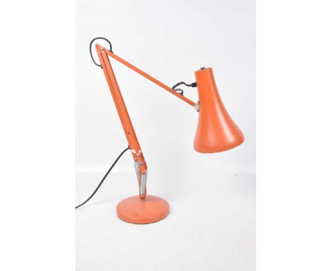 A vintage 1970's angle-poise lamp
The orange metal lamp with articulated arm and flared shade.  Approximate height outstretch