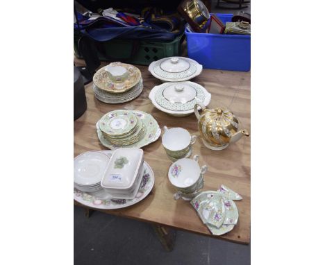 A collection of assorted ceramicsTo include Bristle Stella pattern vegetable dishes and covers, Sadler white and gilt metal h