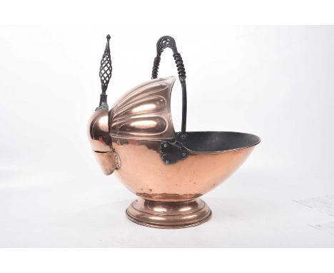 A mid 19th Century copper coal scuttleWith open shelf copper design raised on a spreading circular base with iron work swing 