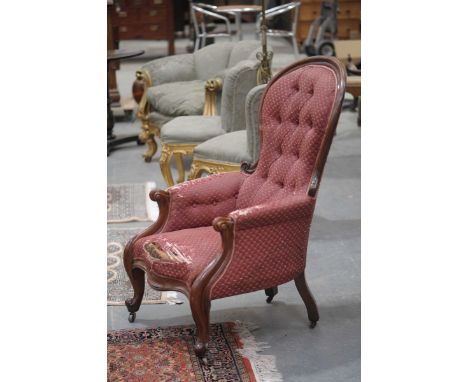 A Victorian mahogany framed balloon back drawing room chairWith an arched button back above padded arms each terminating in c