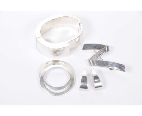 A collection of modern silver jewelleryTo include; a bangle, pendant, brooch and earrings (4)   CONDITION REPORT:  Bangle - s