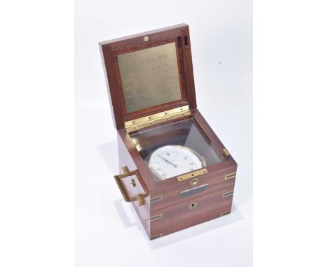 A Relide boxed ships gimbal chronometer
The brass bound mahogany box enclosing brass cased clock with white enamel dial and p