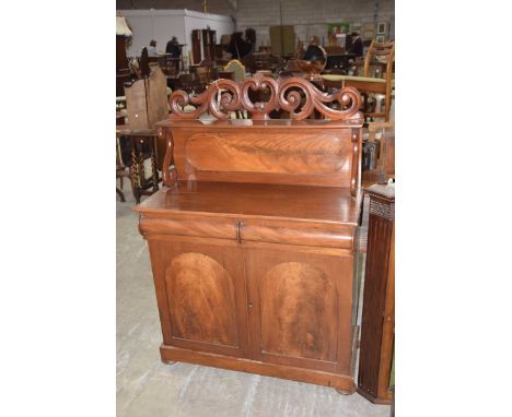 A Victorian mahogany chiffonier sideboardThe raised back with a scrolling leaf pediment above a single shelf, the base with a