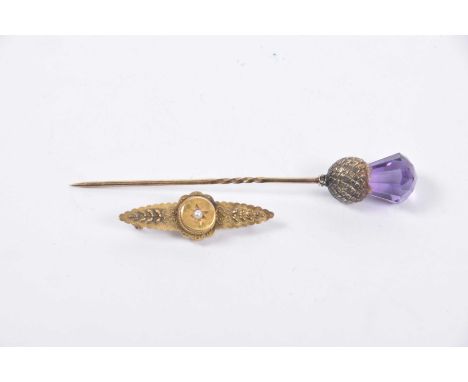 A Victorian 15k gold and seed pearl brooch
Together with, a gem-set thistle stick pin, weight of weighable gold approx. 1.8g 