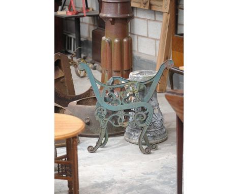 A pair of 19th Century cast iron bench bracket supportsOf scrolling form with central flower heads.
