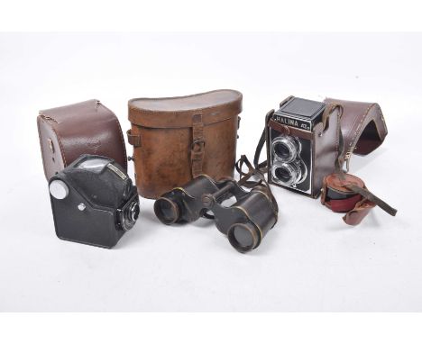 A collection of vintage binoculars and camerasTo include a Halina and Anastigmat boxed camera with case and visual lens, toge