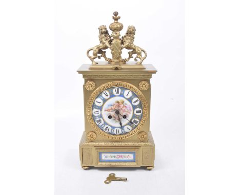 A late 19th Century gilt metal and Sevres style porcelain panel, 8-day mantel clock
The architectural gilt case detailed with