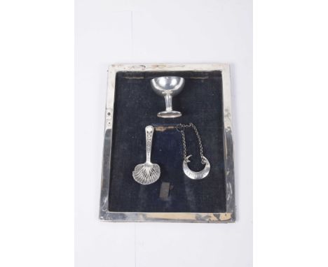 A collection of silver and white metal items To include a Birmingham silver hallmarked photograph frame, a Sherry decanter la