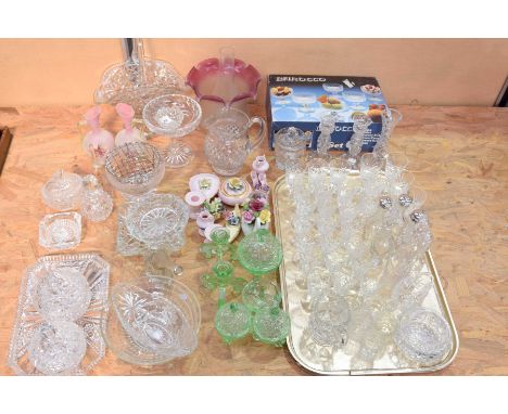 A quantity of cut and pressed glassTo include a Victorian oil lamp shade, various cut glass jugs, candlesticks, sherry and li