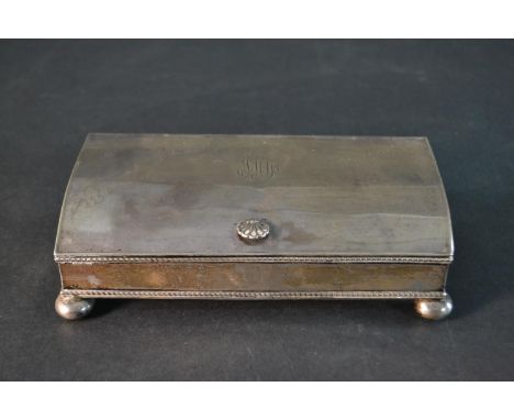 An early 20th century silver desk ink well with two silver topped glass ink well and a central compartment with hinged lid. T