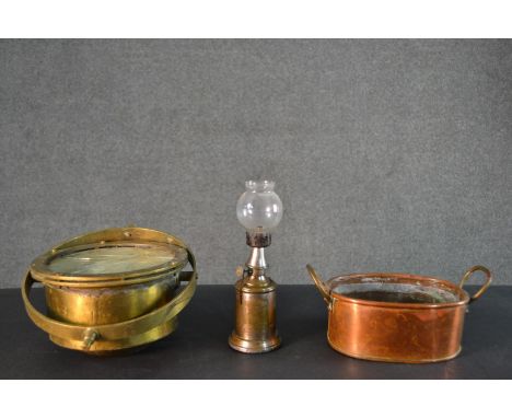A J. Hewitt brass ships compass along with a copper and brass twin handled dish and a French brass oil pigeon lamp, marked 'L
