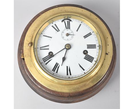 A Vintage Brass Ships Clock Stamped BS Set on Later Turned Wooden Plinth, Working Order, 19.5cms Diameter 