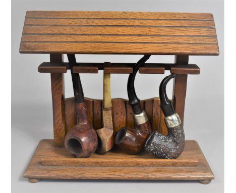 A Mid 20th Century Novelty Four Section Pipe Rack Containing Four Vintage Pipes, 23cms Wide 