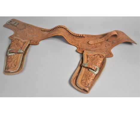 A Vintage Boys Cowboy Gun Belt and Holsters in Tooled Leather 