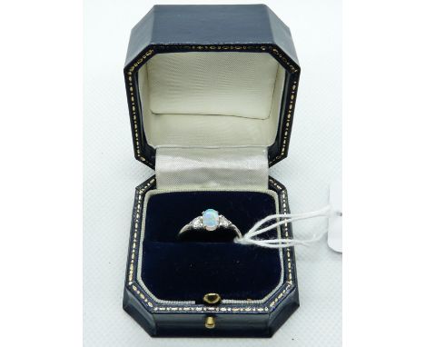 Ladies 18ct White Gold Ring with Oval Claw set Opal flanked by Diamond Shoulders, 2.7g total weight. Size P 