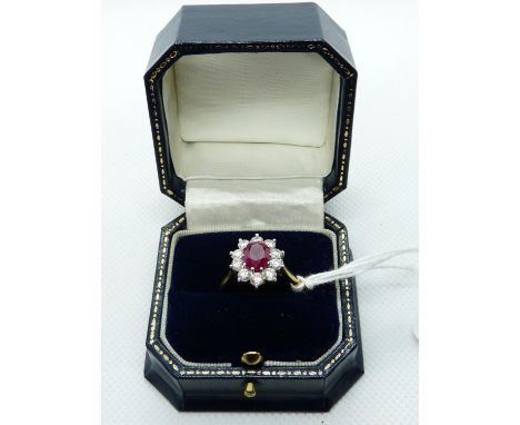 Impressive Ladies 18ct Yellow Gold Ring set with Oval shaped Ruby 1.5ct surrounded by 10 claw set Diamonds 1.00ct estimated. 