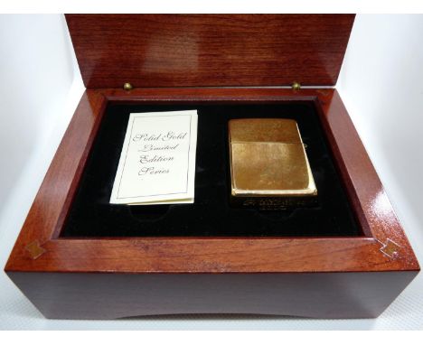 18K Gold Zippo lighter in wooden fitted case with paperwork 53g without inner liner, total weight 79.5g 