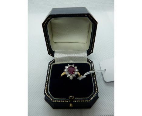 Impressive Ladies 18ct Yellow Gold Ring set with Pear shaped Ruby 1.2ct surrounded by 11 claw set Diamonds 0.80ct estimated. 