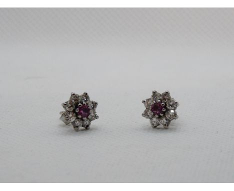 Pair of Ladies Diamond &amp; Ruby Daisy design earrings, 1.2ct estimated Diamond weight and 0.30ct Ruby weight. 2.6g total we