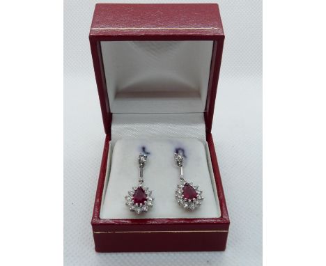 Pair of Bright 18ct White Gold Diamond and Ruby Cluster drop earrings under Diamond claw settings, 0.80ct Ruby estimated and 