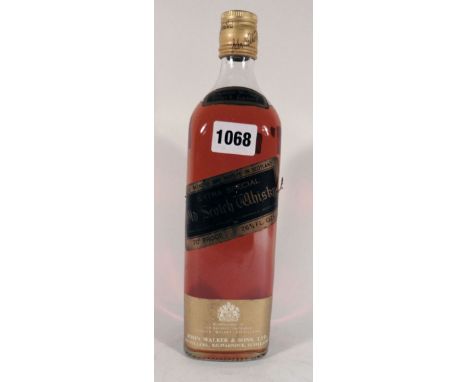 An old bottle of Johnnie Walker Black Label Extra Special Old Scotch Whisky 70proof 26 2/3 floz (circa 1960's)