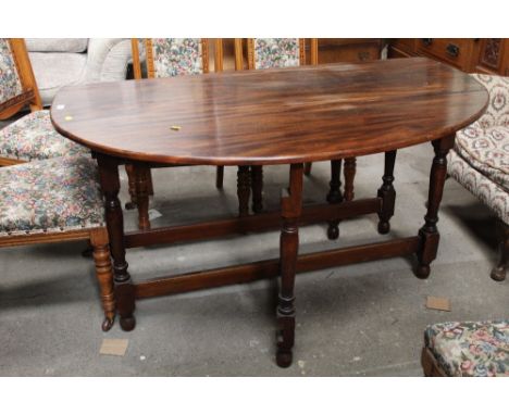 A large mahogany drop leaf gate leg table 