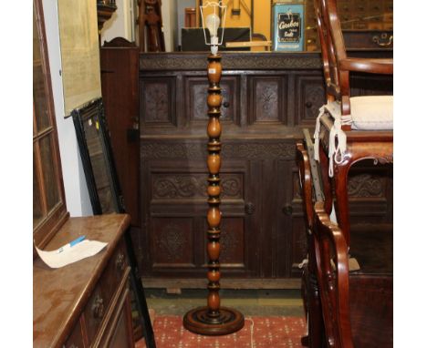 A modern standard lamp with turned column