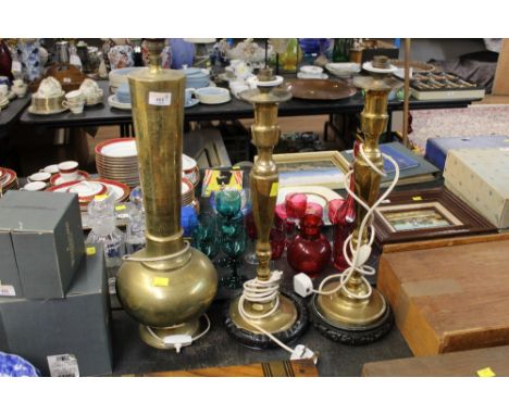 An eastern brass table lamp and sold together with two 19th century brass faceted converted table lamps