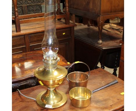 A brass electrified lamp and sold together with miniature pan and jam pan