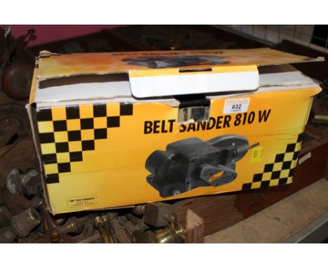 A boxed 810 watt belt sander