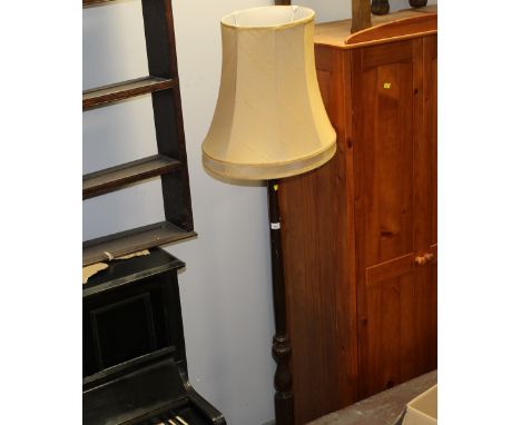 A modern standard lamp with gold coloured shade measuring 188 cm tall