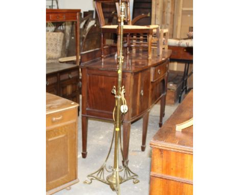 A brass Art Nouveau telescopic standard lamp measuring 160 cm tall