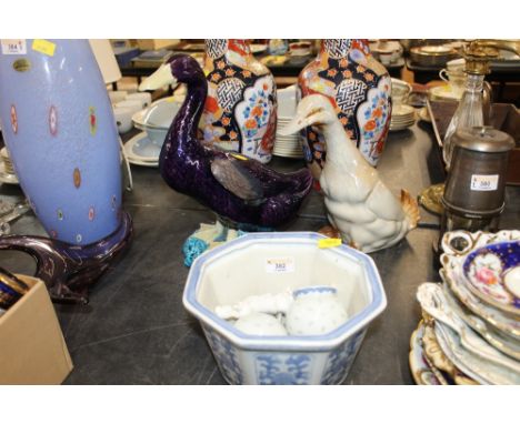 2 glazed pottery duck ornaments, one stamped Made in China to its base, and sold together with an oriental blue and white oct