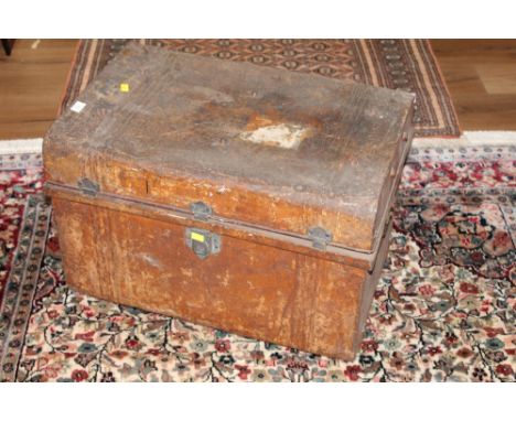 A late Victorian painted metal travelling trunk (dented) with London and North West Rail luggage label