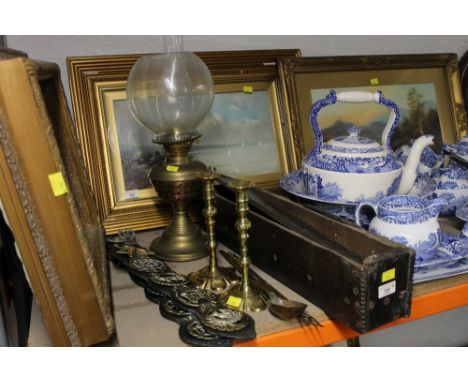 A group lot of brassware, to include candle sticks, oil lamp, and horse brasses 