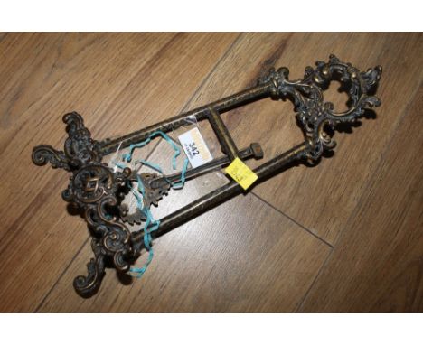 A miniature bronzed metal easel of Rococco style 
