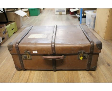 A vintage wood bound leather trunk 