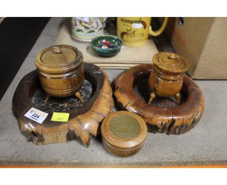 Two yew wood ashtrays or coasters, two turned wood cauldrons, and a lidded trinket box