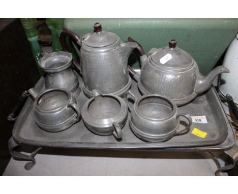 A planished metal part coffee/tea service, with tray and stand 