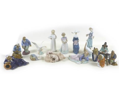 A collection of Lladro figurines, including 'Girl with Duck', SKU 01001052, 25cm high, a sitting nun doing cross stitch, 21.5