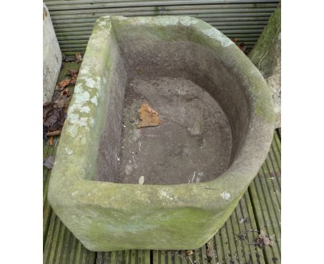An early 20th century stone trough originally from a Tetbury piggery, 63 by 46 by 27cm high. 