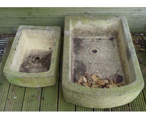 Two Sanford Stone troughs, small trough measures 52 by 38 by 18cm high, large trough measures 73 by 52 by 26cm high. (2) 