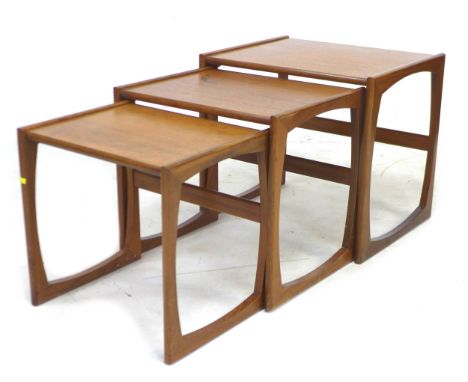 A retro G-Plan teak nest of three occasional tables, from the Quadrille Range designed by R. Bennett, largest 53.5 by 43.5 by