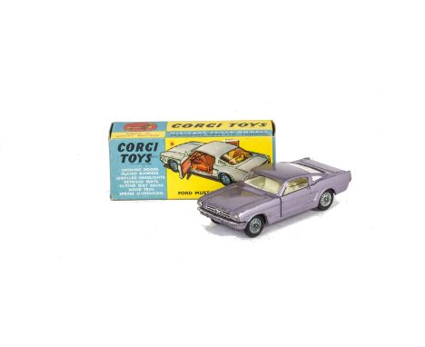 A Corgi Toys 320 Ford Mustang Fastback 2+2, metallic lilac body, cream interior, spoked hubs, in original box, VG-E, box VG 