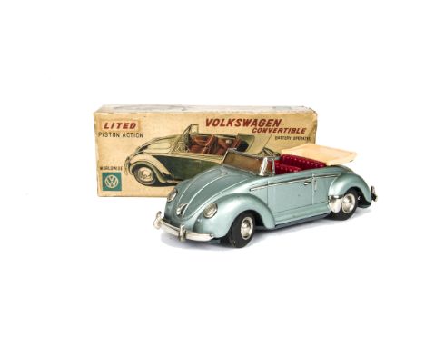 A Nomura (T.N) Japan Tinplate Volkswagen Convertible, battery-operated model, light metallic blue tinplate body, red plastic 