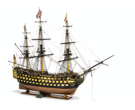 A fine wooden scale model of HMS Victory,  fully detailed with full rigging and cannons, length 42cm, height 70cm, width 18cm