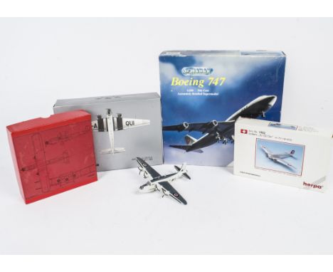 A small collection of model aircraft, including a Schabar Boeing 747 in Pan Am livery, a pair of Herpa Junkers JU52 type airc