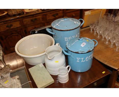 An enamel bread bin; an enamel flour bin; two large pottery bowls, two white glazed pottery jugs etc.