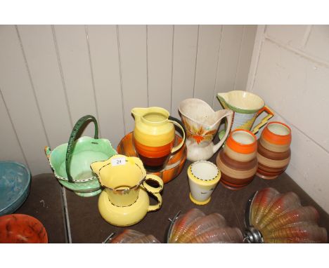 A pair of Art Deco design baluster vases with orange and brown ring decoration; a Burleigh ware "Sunray" pattern vase; variou