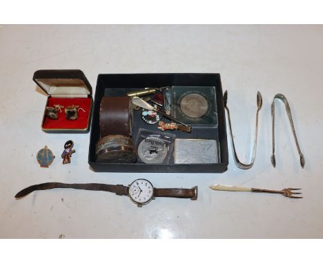 A box containing two pairs of silver sugar tongs. a silver and mother of pearl handled fork, wrist watch, cuff-links etc.